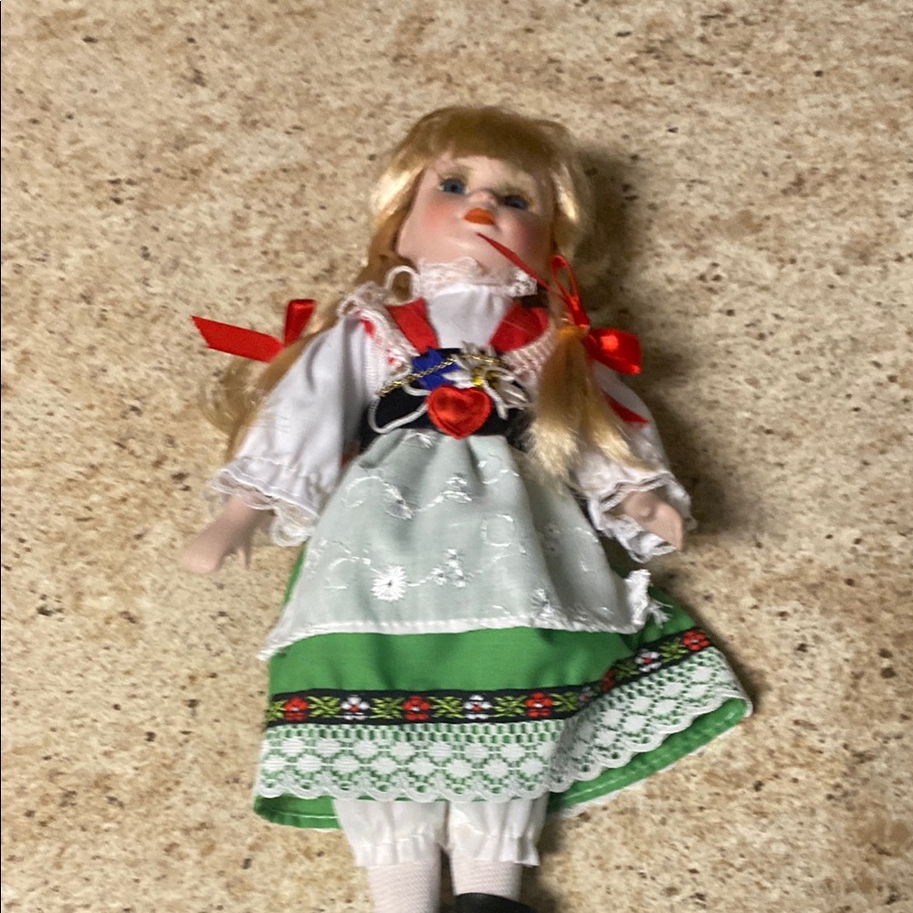 Traditional Doll with Green Dress and Red Accents